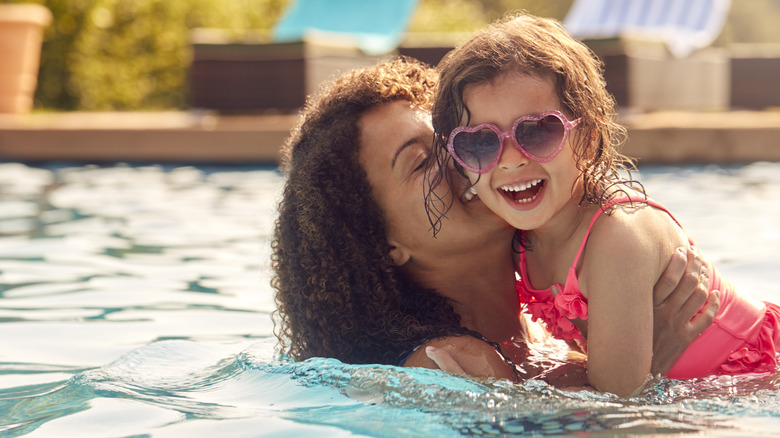 Mother and daughter swimming 