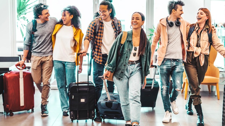 Young travelers with suitcases