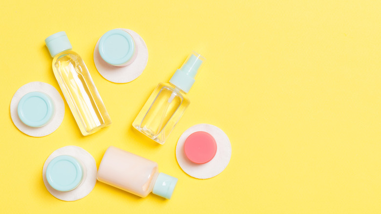 travel size toiletries on yellow background