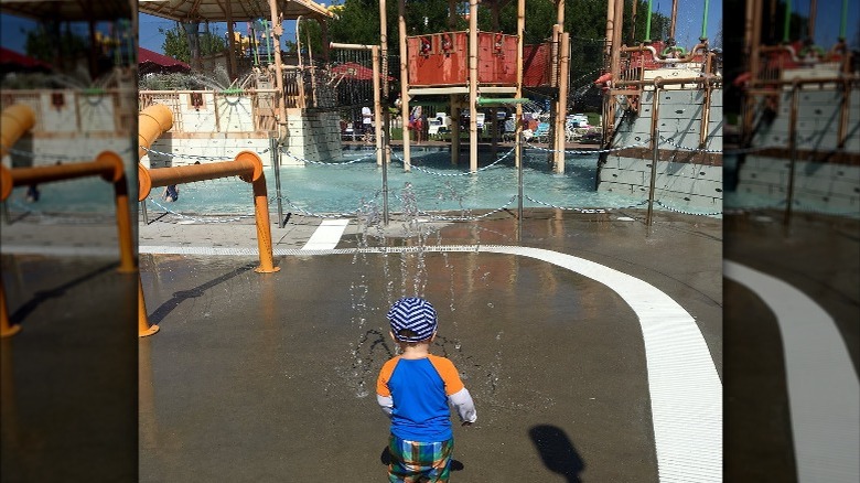 child at splash pad