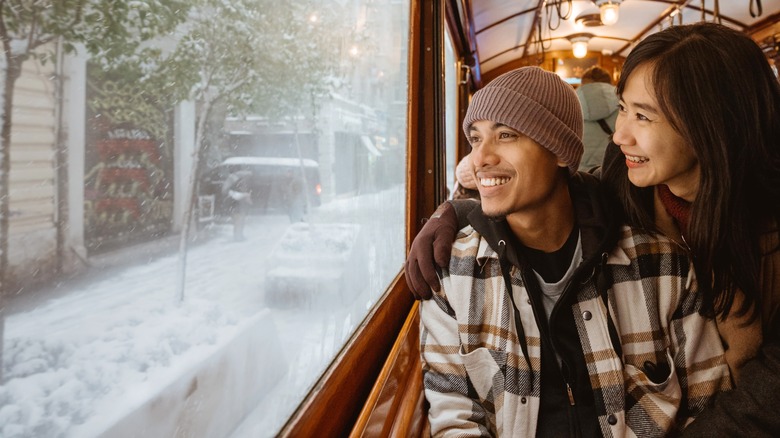 People look through train window