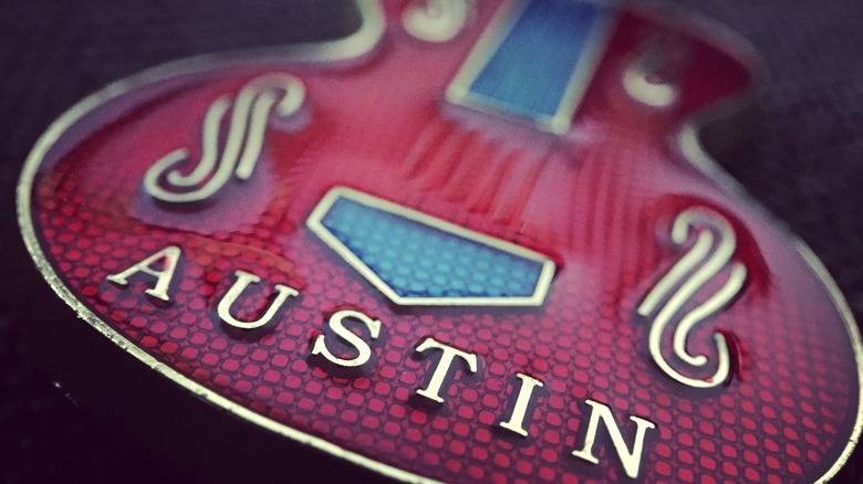 An electric guitar is embossed with the name Austin