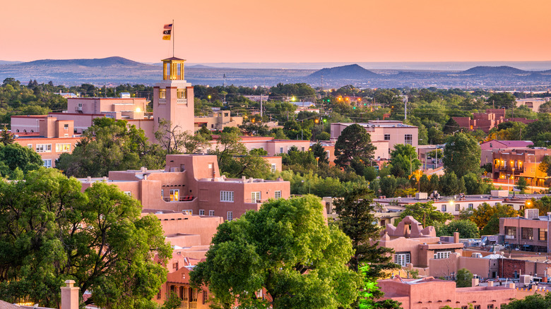 The New Mexico State House has pink-tinted walls in a Santa Fe sunset