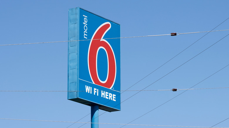 Motel 6 sign against sky