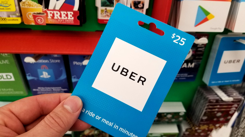 Uber gift card in hand