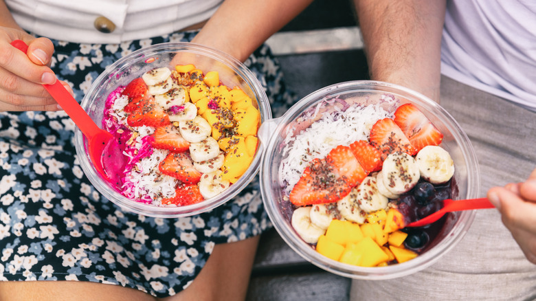 Couple with acai bowls