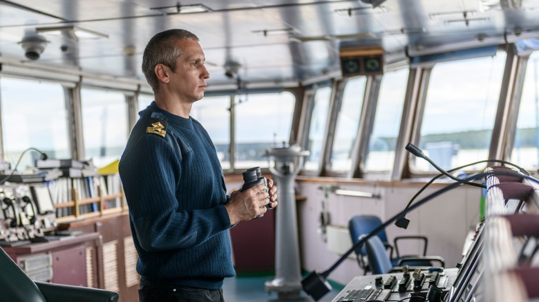 Crew member on the bridge of a boat