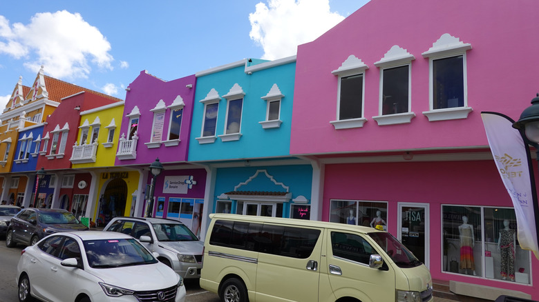 Brightly painted storefronts line a Bonaire street