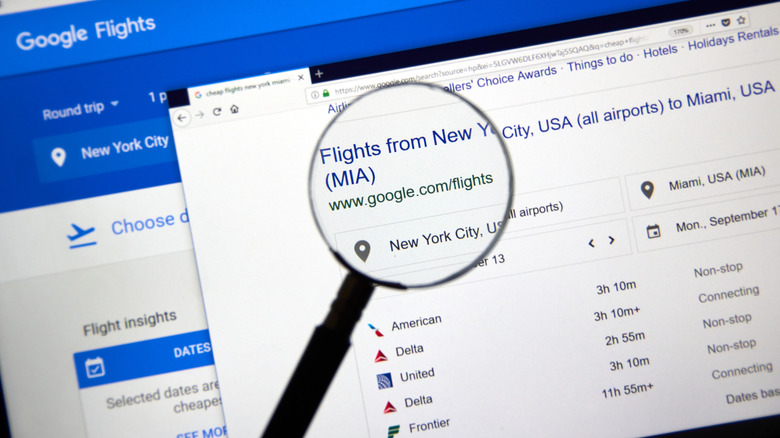 Google Flights screen with magnifying glass