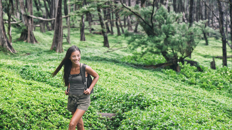 woman hiking in Hawaiian forest