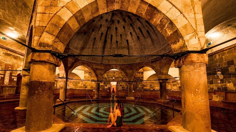 woman sitting in rudas bathhouse