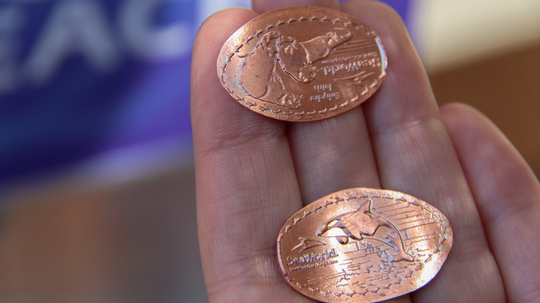 Pressed pennies in hand