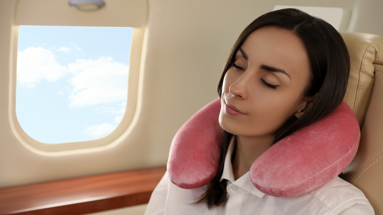 Girl sleeping on plane