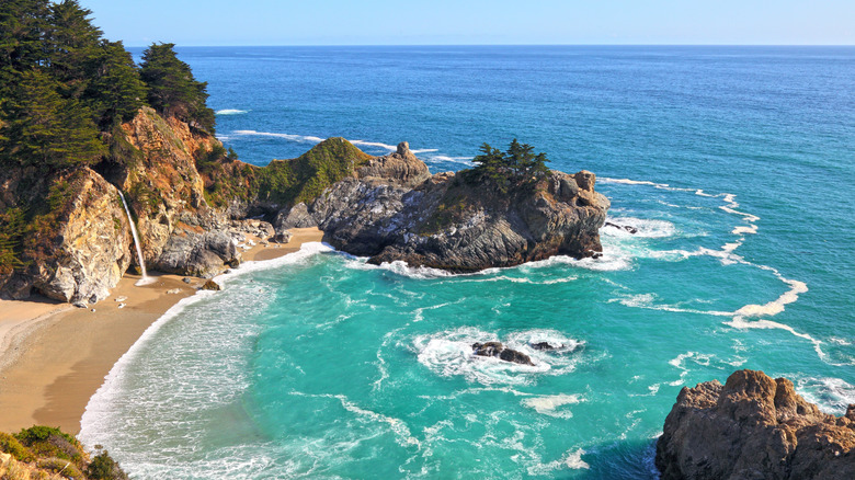 waterfall flows into ocean