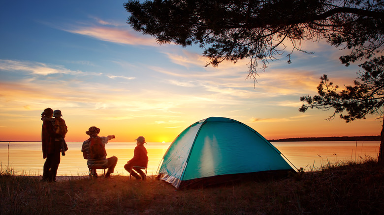 Family camping by the ocean