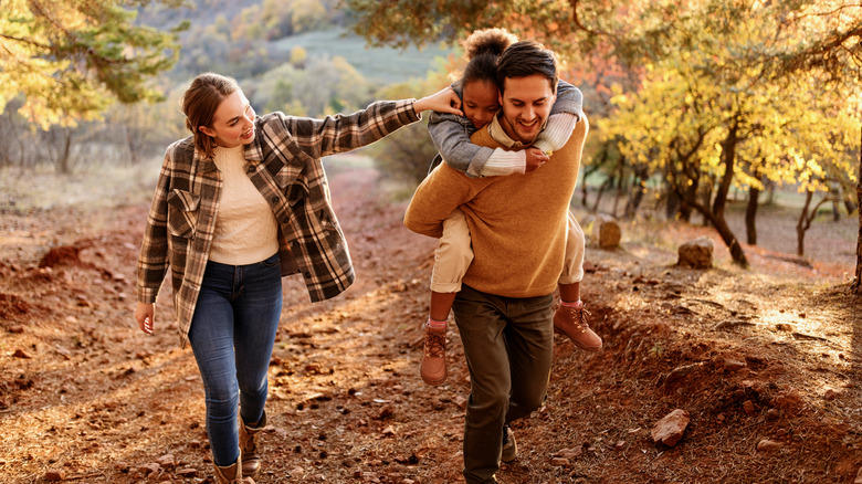 family hiking in forest