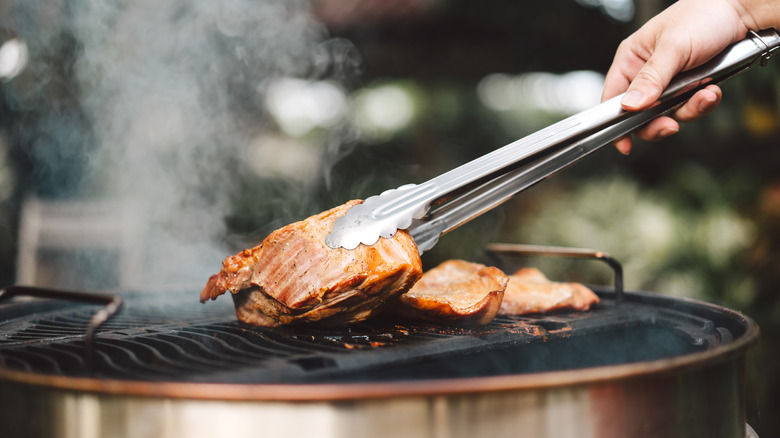 cooking meat on a barbecue