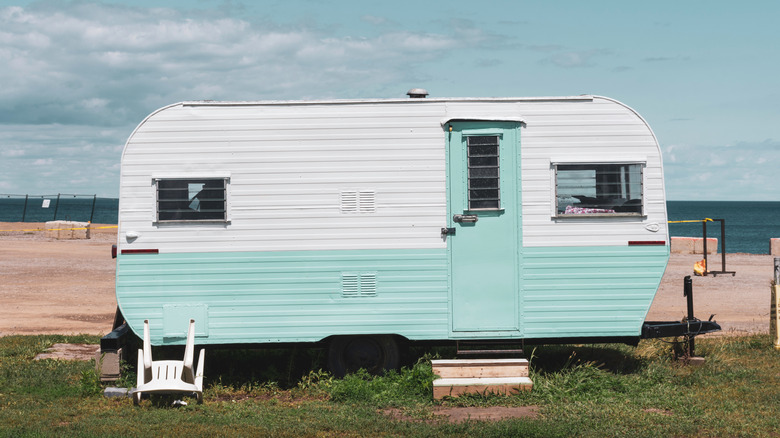 Retro camper parked on beach