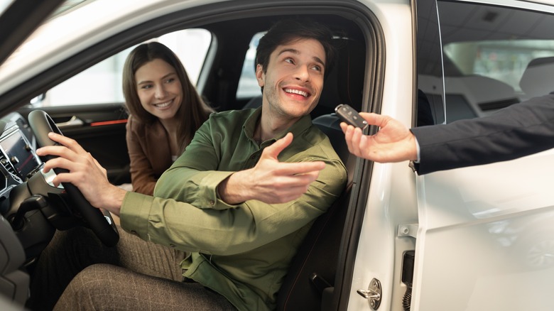 Couple renting a car