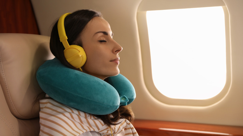 woman sleeping on airplane