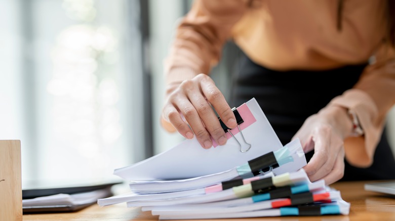 Person going through paperwork 