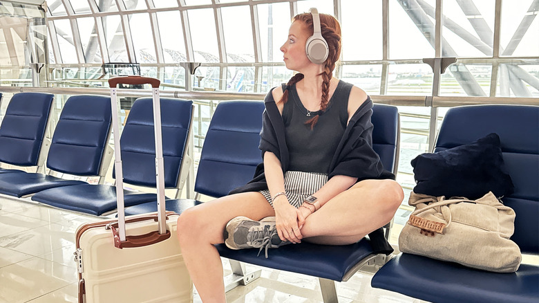 Traveler sitting in airport lounge