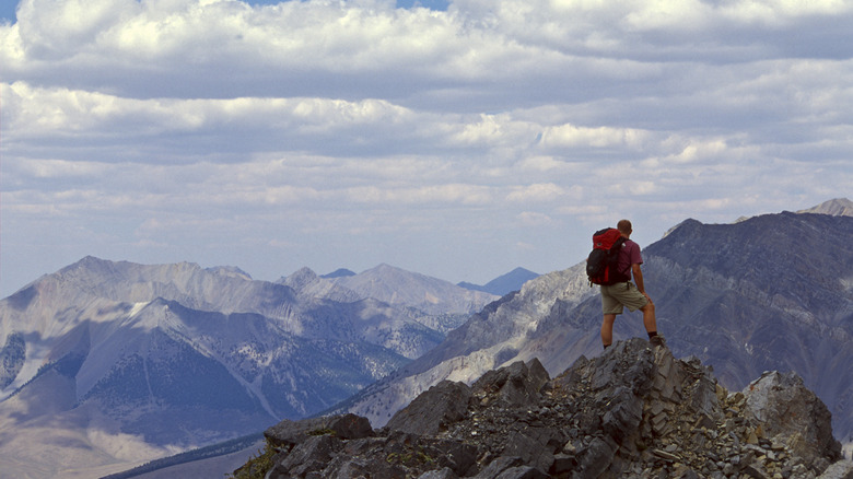 Man summiting Mount Borah