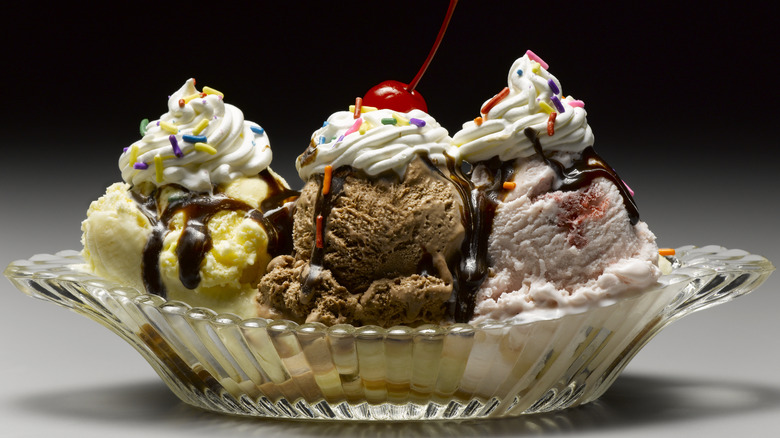 Hot fudge sundae with whipped cream and sprinkles.