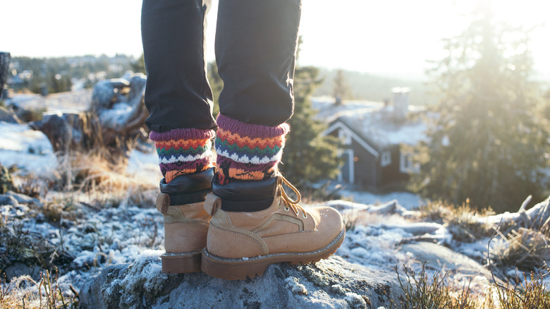 Person with pants tucked into socks