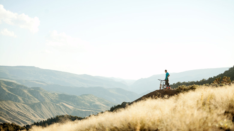 Mountain biker looking out over the mountains in Colorado