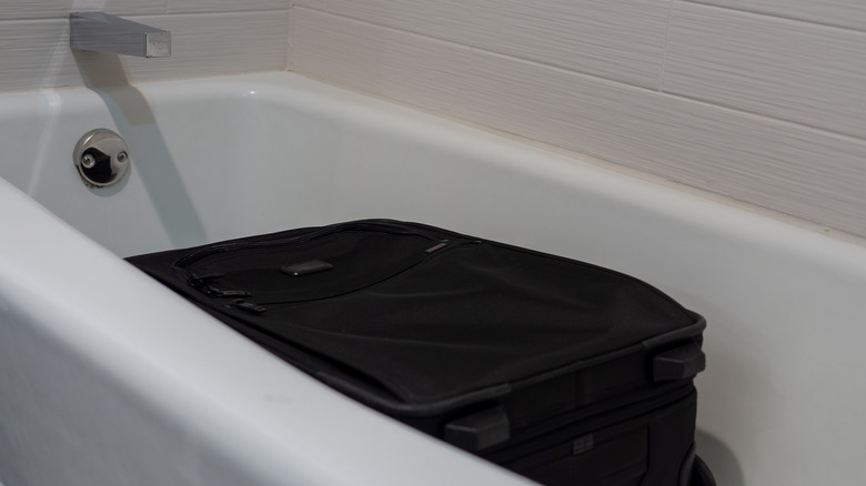 suitcase in bathtub 