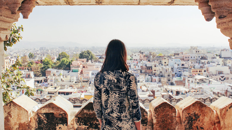 Traveler overlooking a cityscape
