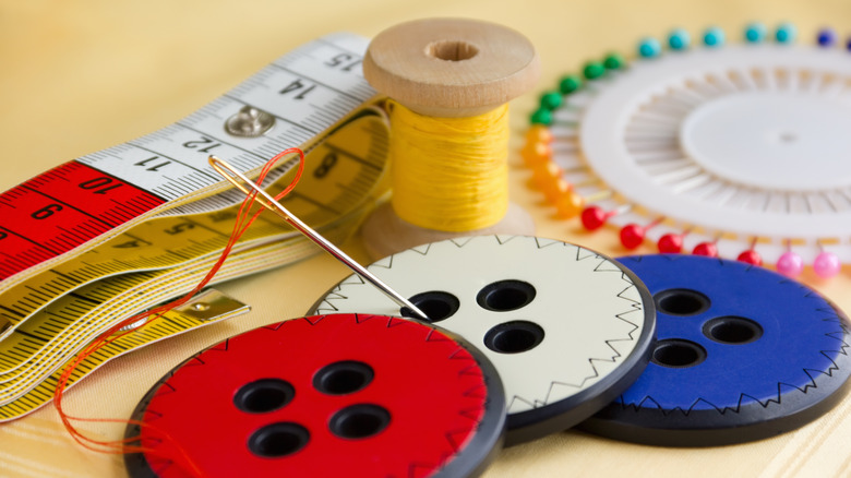 Buttons, needle, and thread