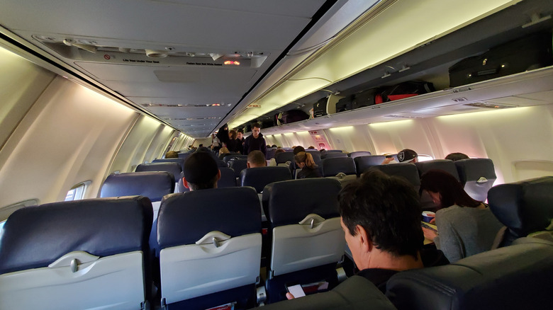 Viewpoint from seat of people boarding Southwest plane