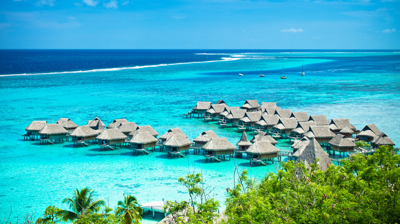 overwater bungalows in blue water