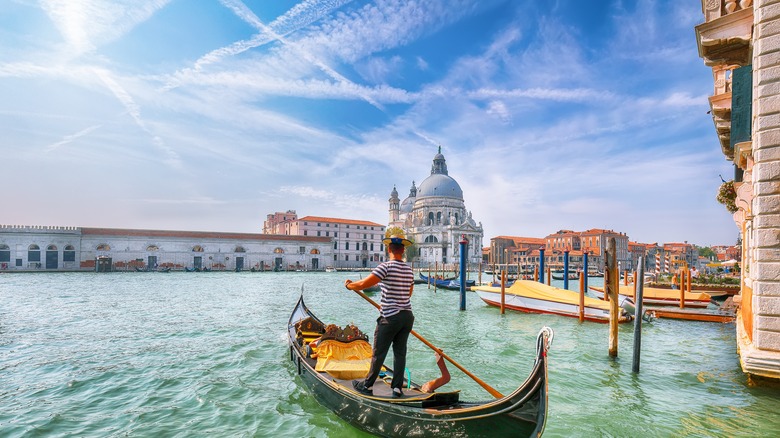 Man on gondola in Venice