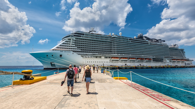 People walking pier cruise ship