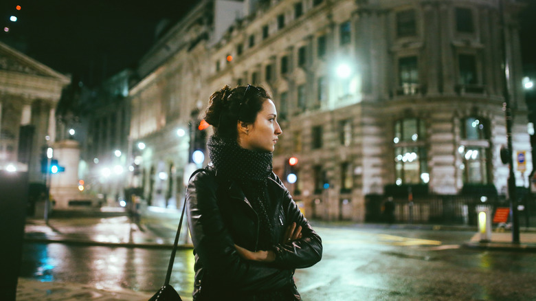 Woman in London at night