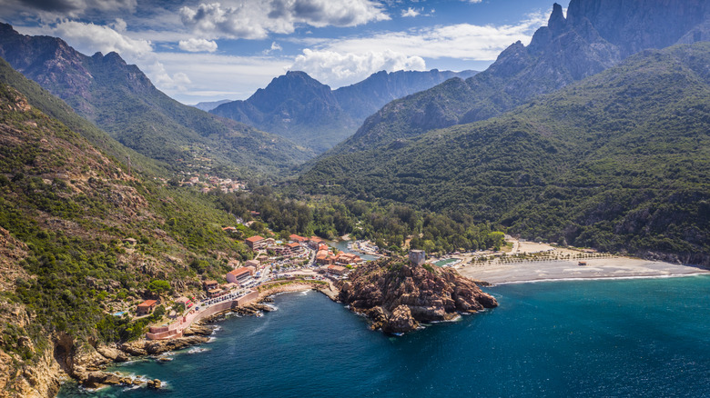 aerial of coastal town in mountains