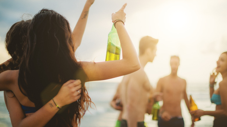 Young adults drinking Rimini beach