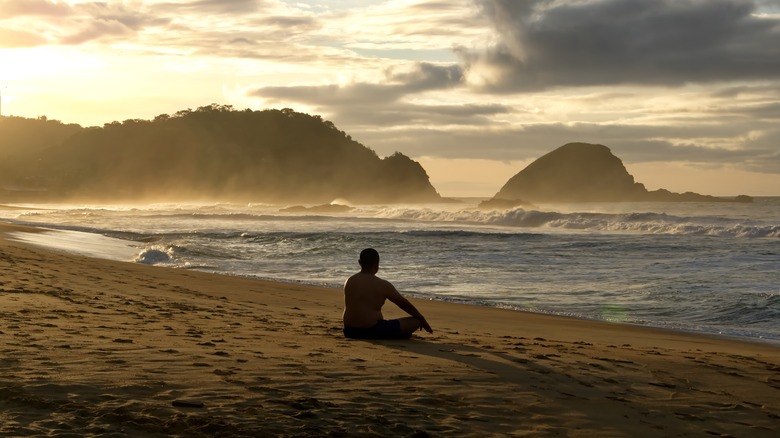 Man meditating on Zipolite Beach