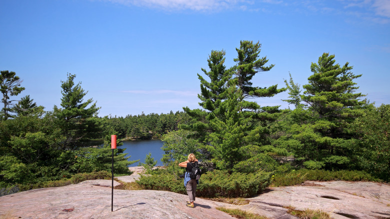 Visitor hiking on Beausoleil Island