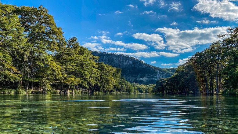 clear river with mountain backdrop