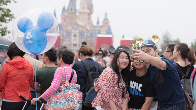 guests taking photo Disney park