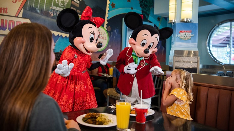 Minnie and Mickey meeting child