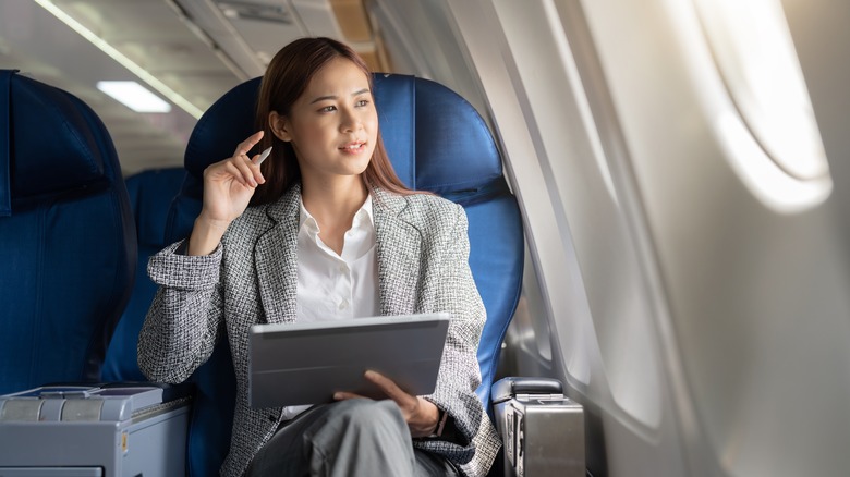 Woman flying business class