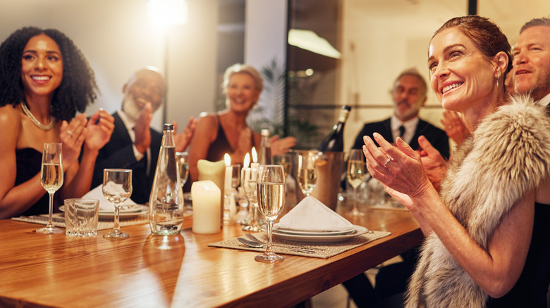 Group wining and dining at a formal dinner