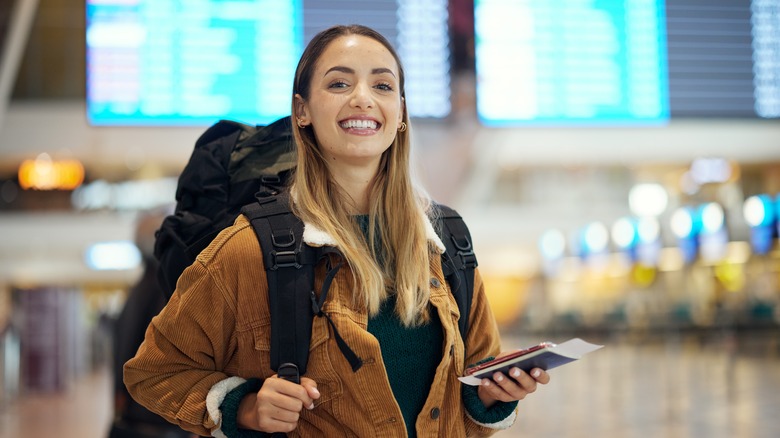 Tourist with passport in airport