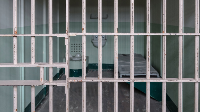 Jail cell behind bars