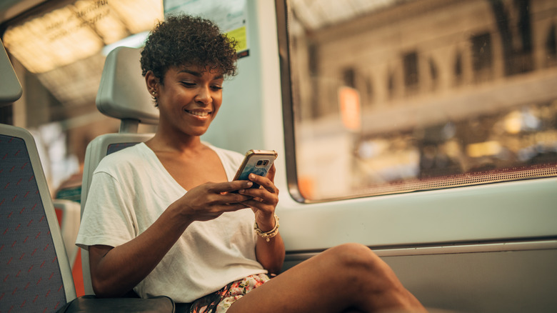 Train traveler on phone